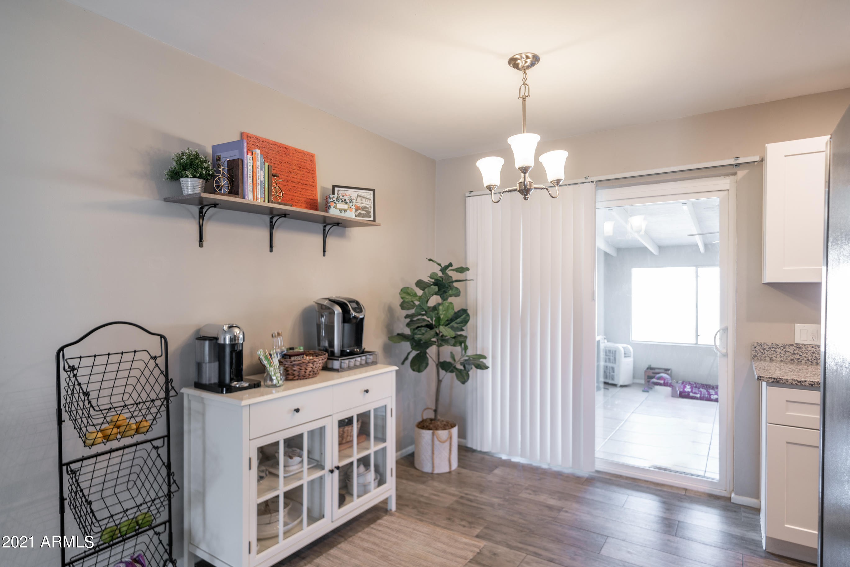 3034 East Osborn Road Phoenix, AZ 85016 - Photo 7 of 24 a view of a hallway with wooden floor and windows