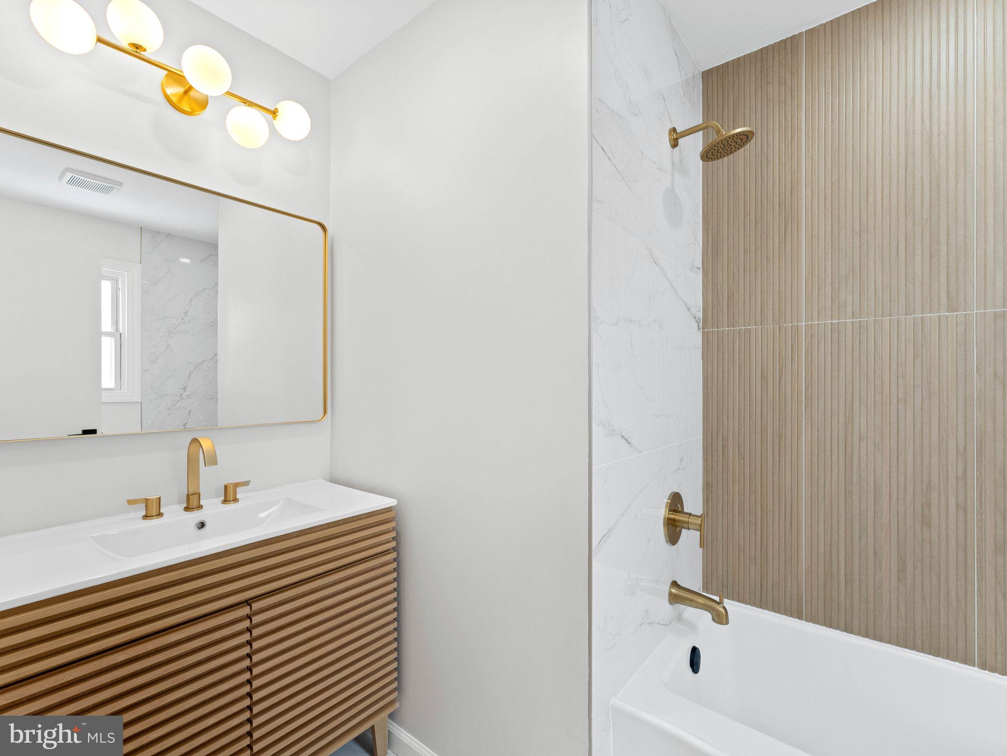 535 Main Street Glendora, NJ 08029 - Photo 17 of 33 a bathroom with a sink and a bathtub