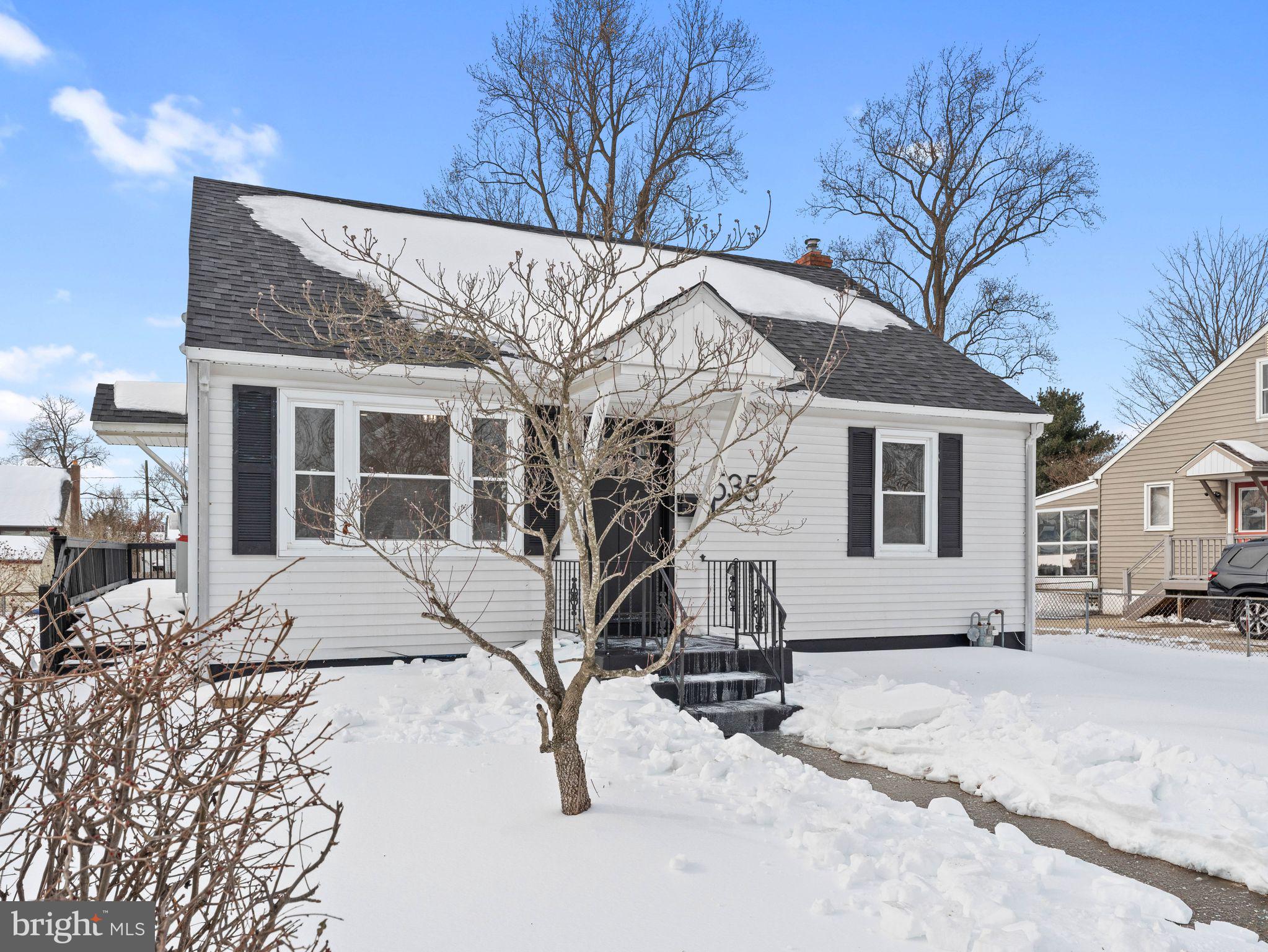 535 Main Street Glendora, NJ 08029 - Photo 2 of 33 a view of a house with snow on the road