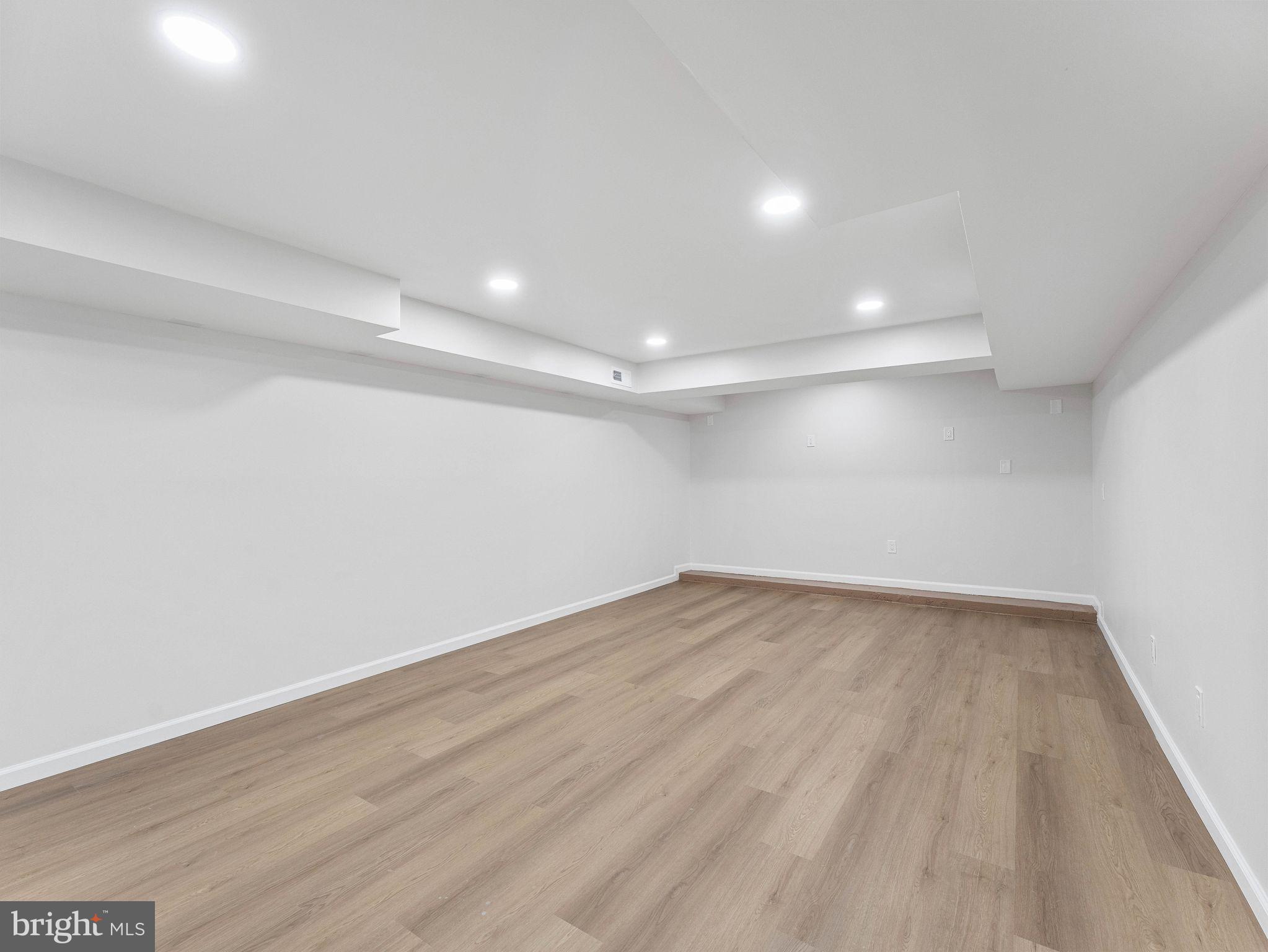 535 Main Street Glendora, NJ 08029 - Photo 28 of 33 a view of an empty room with wooden floor and a window