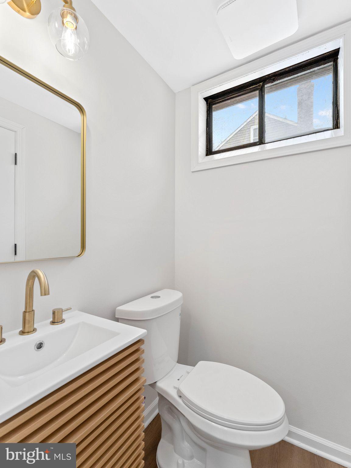 535 Main Street Glendora, NJ 08029 - Photo 29 of 33 a white toilet sitting next to a bathroom sink