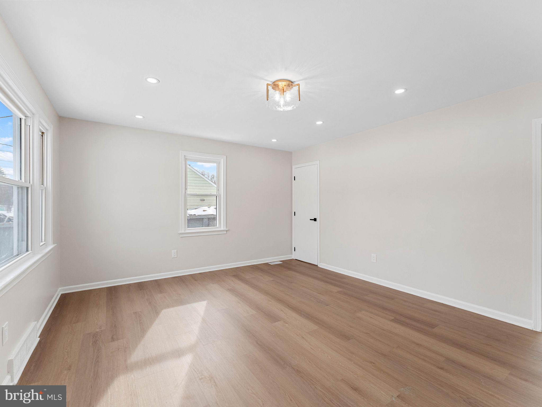 535 Main Street Glendora, NJ 08029 - Photo 4 of 33 wooden floor in an empty room with a window