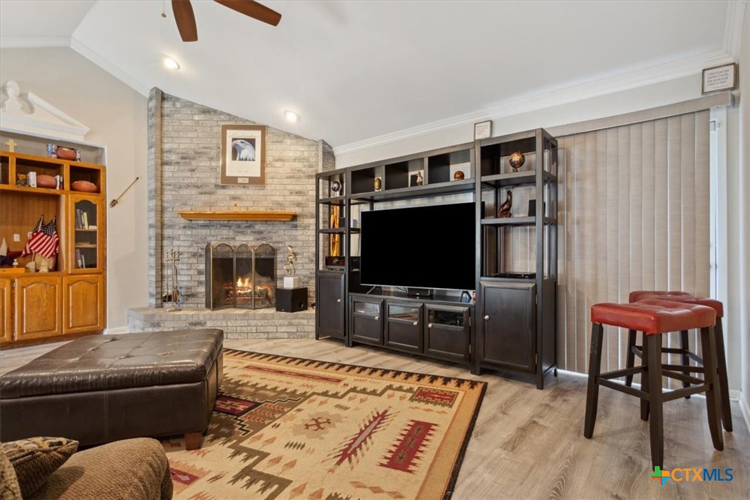 8 West Aztec Lane Belton, TX 76513 - Photo 12 of 37 a living room with furniture and a flat screen tv
