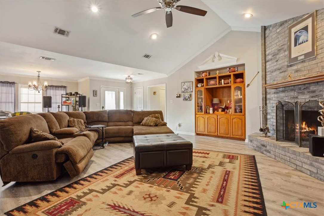 8 West Aztec Lane Belton, TX 76513 - Photo 13 of 37 a living room with furniture and a fireplace
