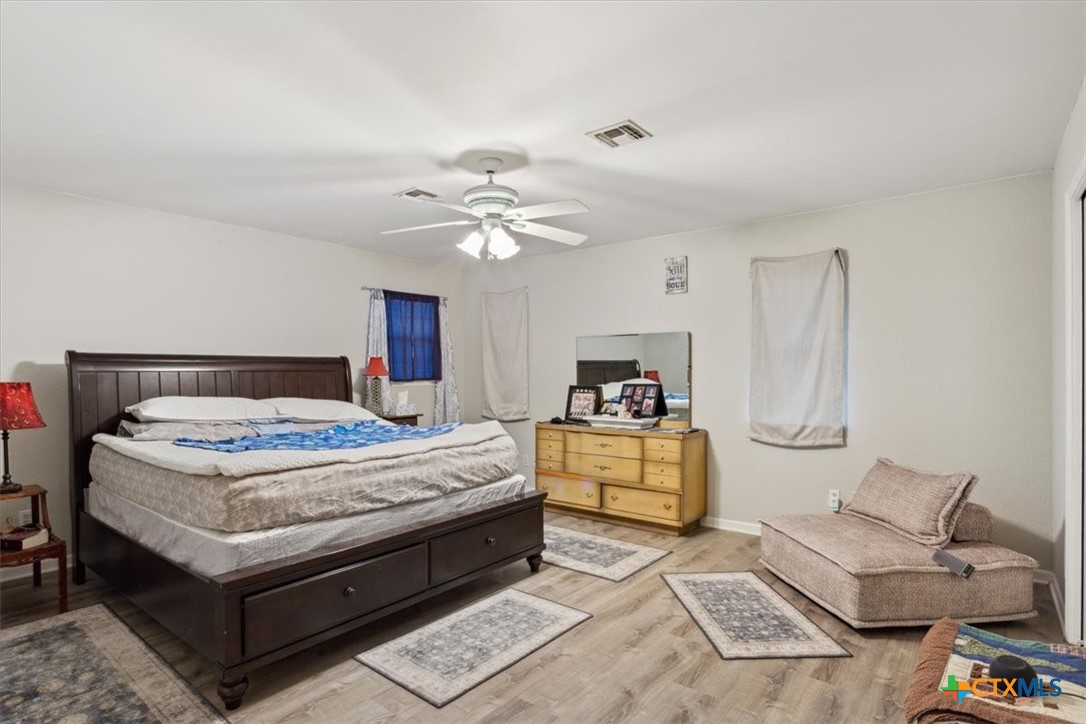 8 West Aztec Lane Belton, TX 76513 - Photo 19 of 37 a bedroom with a bed and furniture