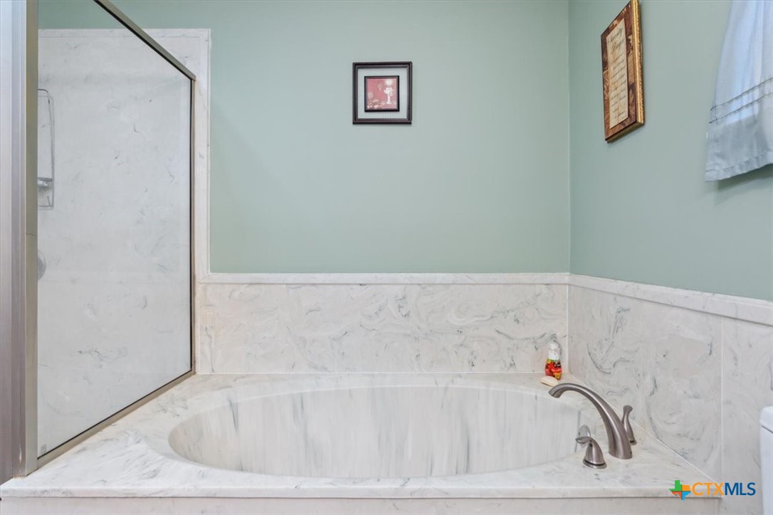 8 West Aztec Lane Belton, TX 76513 - Photo 24 of 37 a bathroom with a bathtub