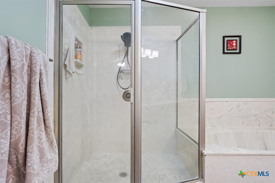 8 West Aztec Lane Belton, TX 76513 - Photo 25 of 37 a bathroom with a shower and a sink