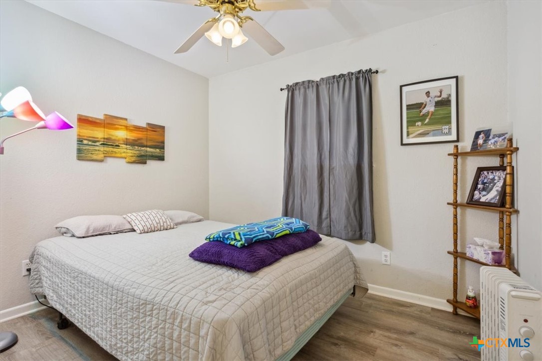 8 West Aztec Lane Belton, TX 76513 - Photo 26 of 37 a bedroom with a bed and a flat screen tv