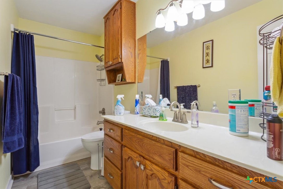8 West Aztec Lane Belton, TX 76513 - Photo 28 of 37 a bathroom with a sink a toilet and a mirror