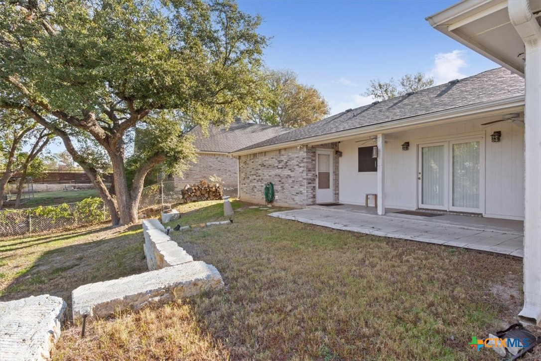 8 West Aztec Lane Belton, TX 76513 - Photo 31 of 37 a view of a backyard with a tree