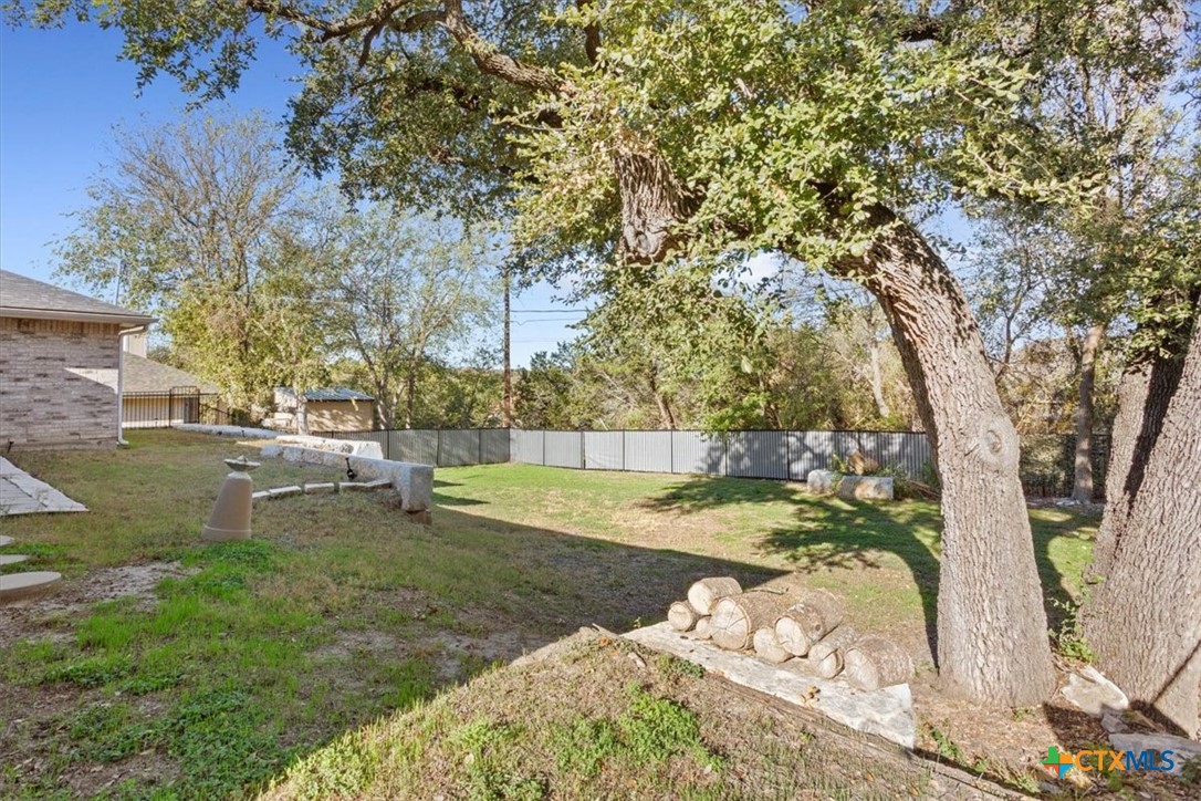 8 West Aztec Lane Belton, TX 76513 - Photo 32 of 37 a view of a yard with large trees