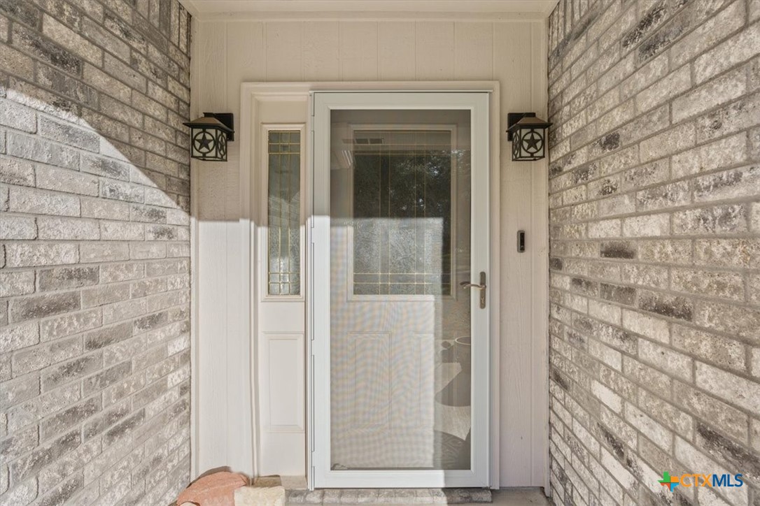 8 West Aztec Lane Belton, TX 76513 - Photo 6 of 37 a view of a brick house with a door