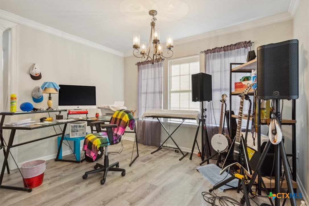 8 West Aztec Lane Belton, TX 76513 - Photo 8 of 37 a view of a workspace with furniture and a flat screen tv