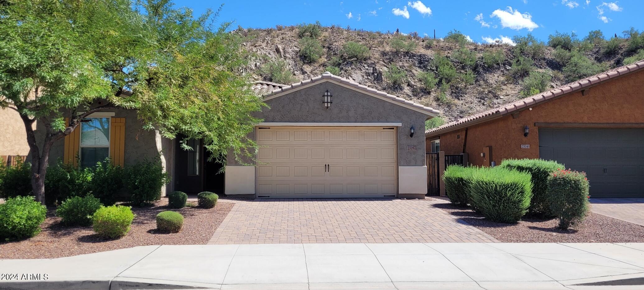 a house view with a garden space