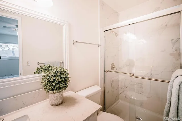 a white bath tub sitting next to a white door