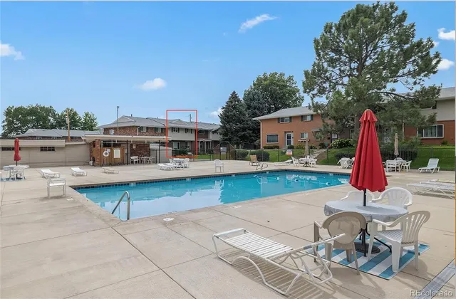 a view of a swimming pool with a patio