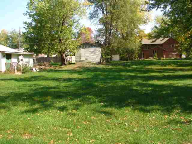 107 Jefferson Street Ridott, IL 61067 - Photo 4 of 10 a front view of a house with a garden