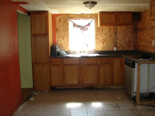 107 Jefferson Street Ridott, IL 61067 - Photo 8 of 10 a kitchen with a sink and a window