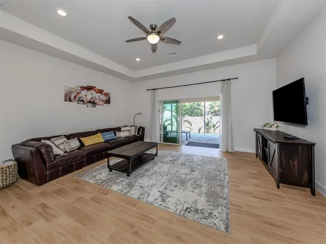 a kitchen with stainless steel appliances granite countertop a refrigerator a sink and a granite counter tops