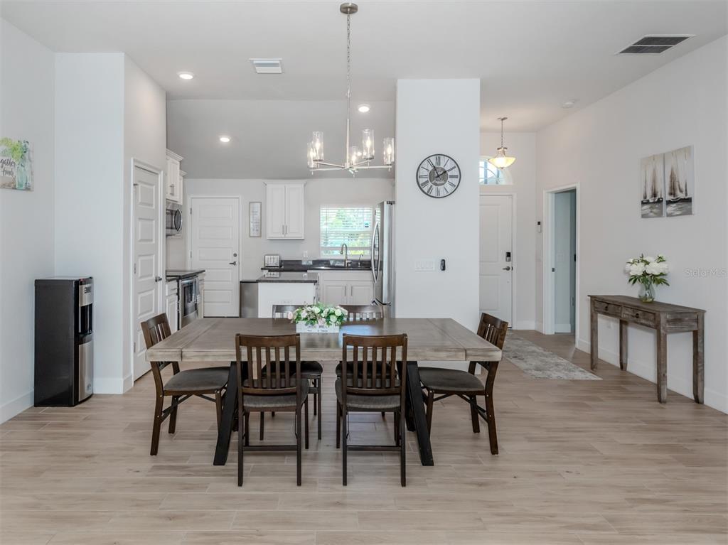 1190 Euclid Road Venice, FL 34293 - Photo 22 of 100 a view of a a dining room with furniture window and wooden floor