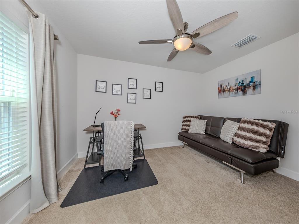 1190 Euclid Road Venice, FL 34293 - Photo 33 of 100 a living room with furniture and a window