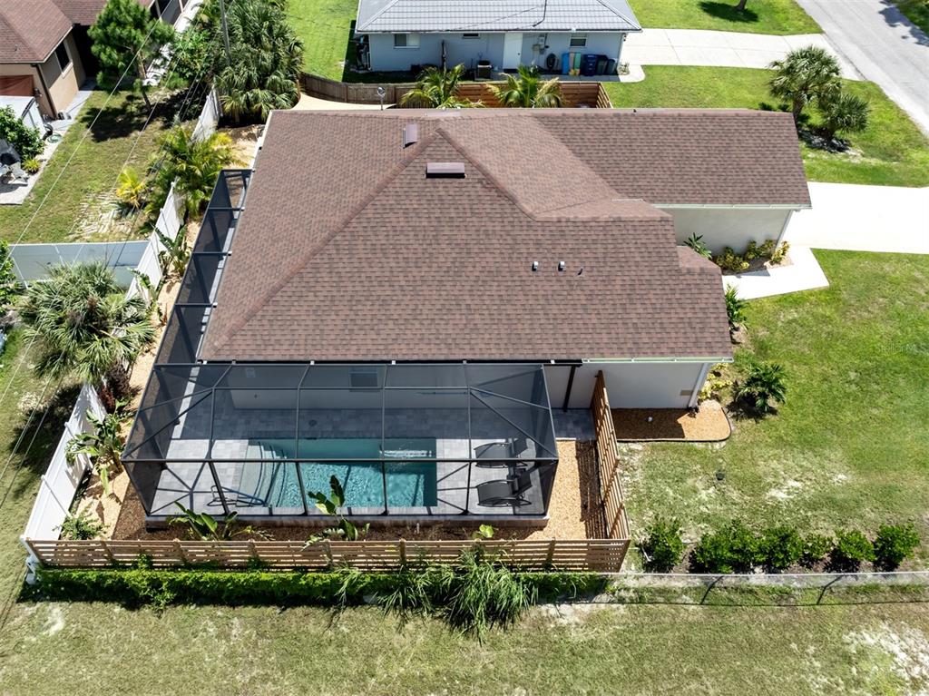 1190 Euclid Road Venice, FL 34293 - Photo 4 of 100 an aerial view of a house with a yard and lake view