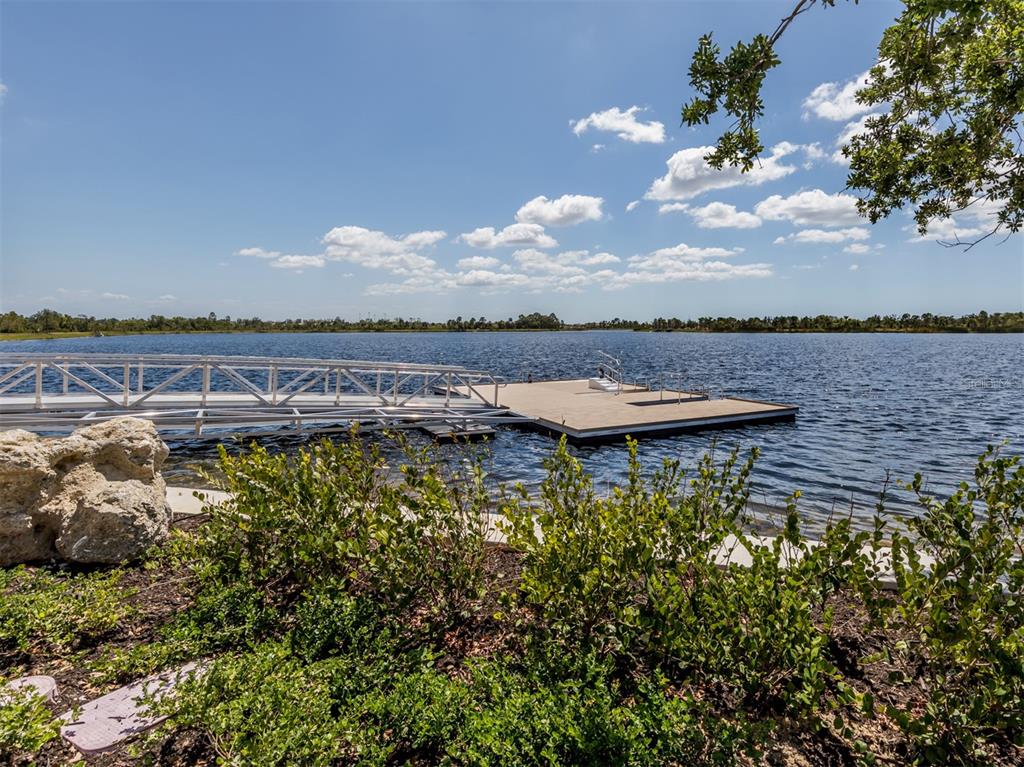 1190 Euclid Road Venice, FL 34293 - Photo 88 of 100 a view of a lake with houses in the back