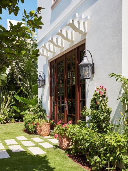 300 Indian Road Palm Beach, FL 33480 - Photo 16 of 42 a front view of a house with garden