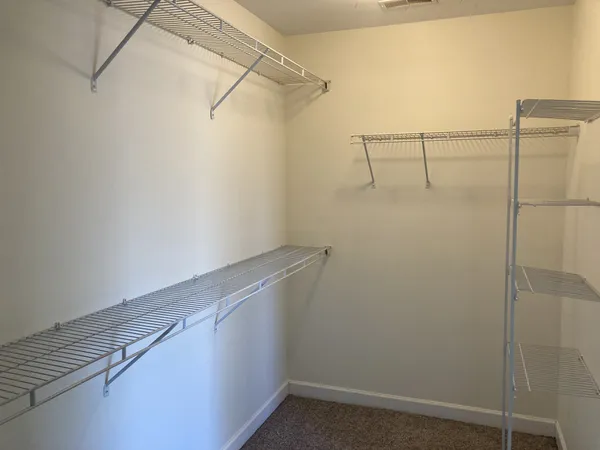 a view of a room with racks on the wall