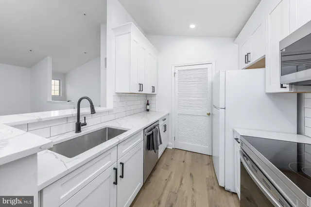 a view of a kitchen with sink