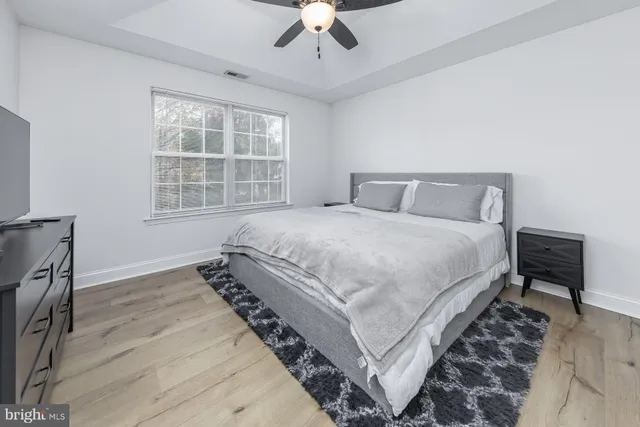 a bedroom with bed and a window