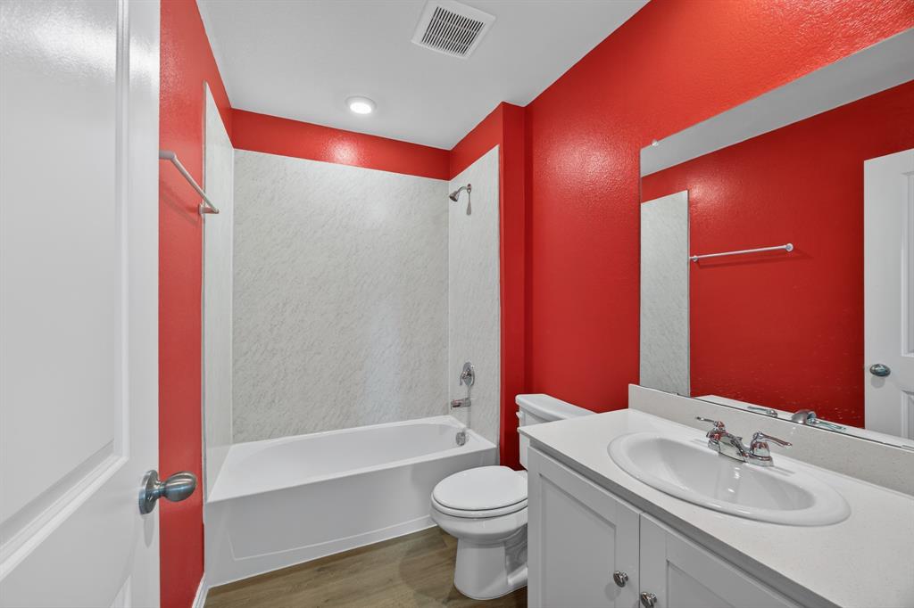 709 Chipper Trail Lavon, TX 75166 - Photo 12 of 17 a bathroom with a sink and a mirror