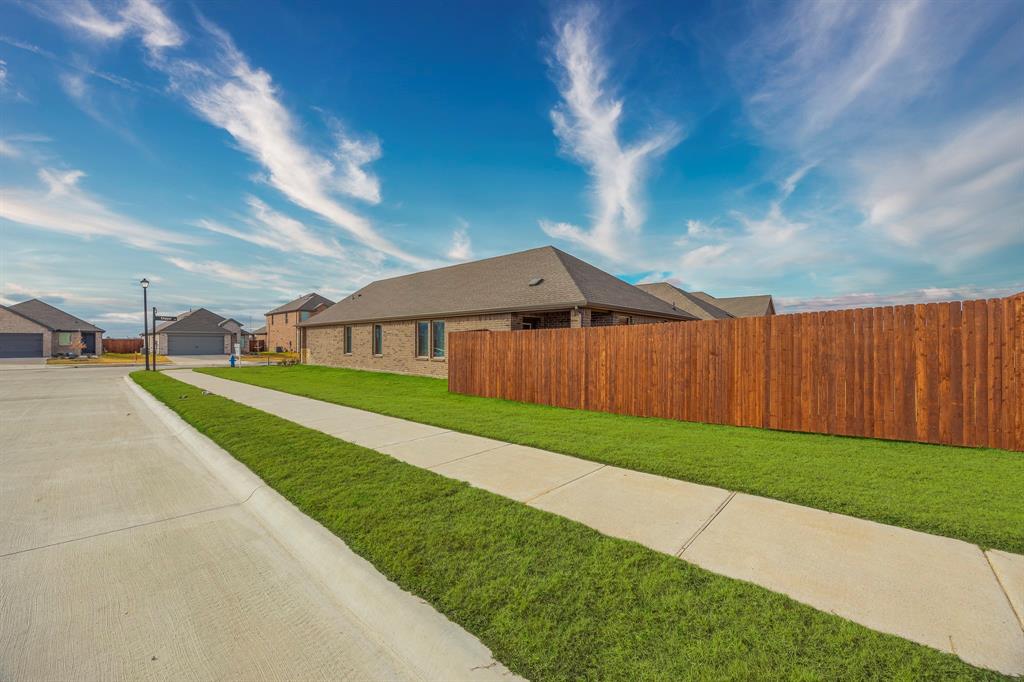709 Chipper Trail Lavon, TX 75166 - Photo 17 of 17 a view of an house with backyard and garden