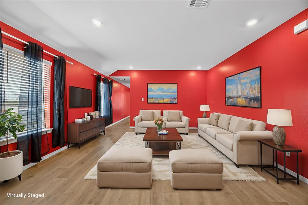 709 Chipper Trail Lavon, TX 75166 - Photo 3 of 17 a living room with furniture and a flat screen tv