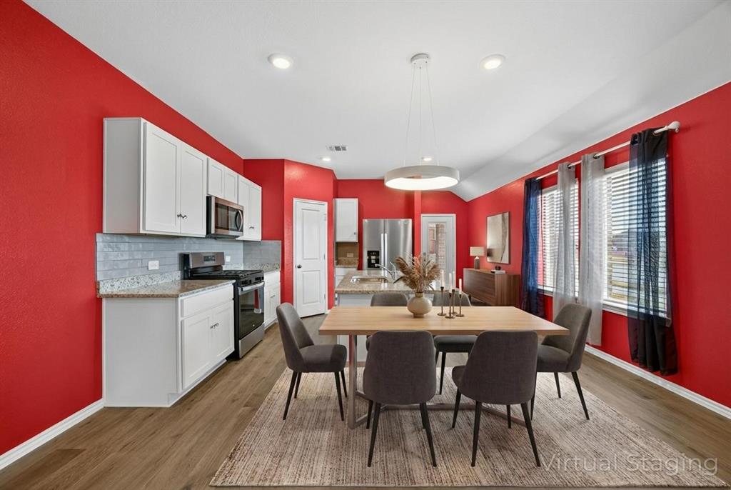 709 Chipper Trail Lavon, TX 75166 - Photo 4 of 17 a view of a dining room with furniture window and wooden floor