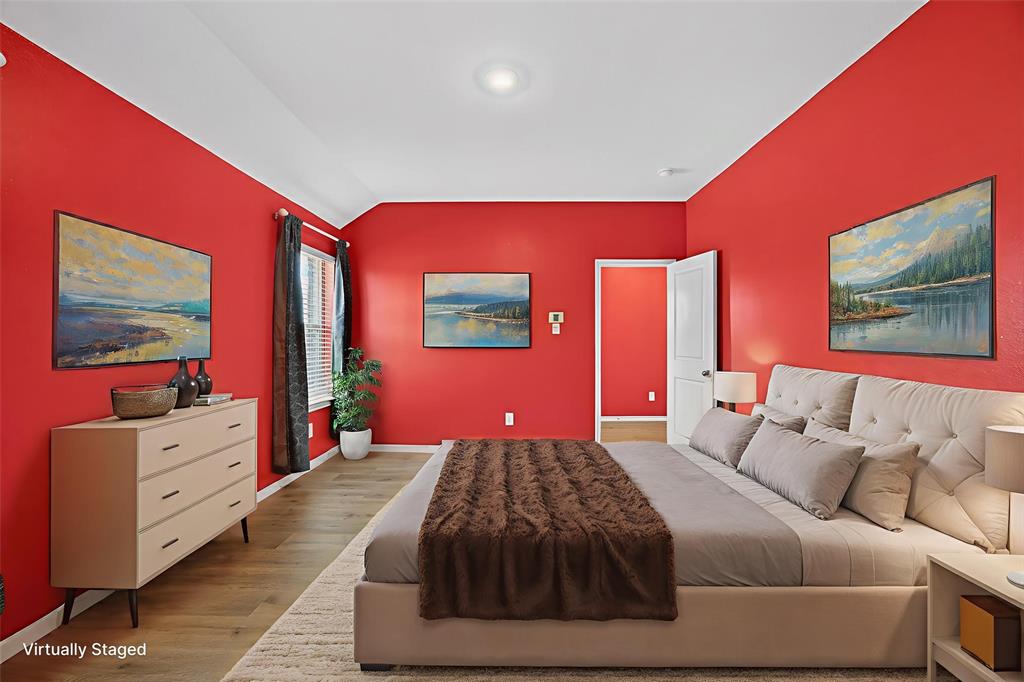 709 Chipper Trail Lavon, TX 75166 - Photo 6 of 17 a bedroom with a bed and dresser with mirror