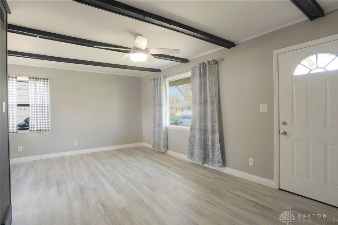 1627 Joselin Road Dayton, OH 45432 - Photo 6 of 28 This bright living space features exposed beam ceilings and durable flooring.