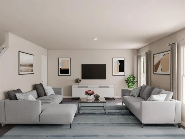 a kitchen with a stove a microwave and a dining table