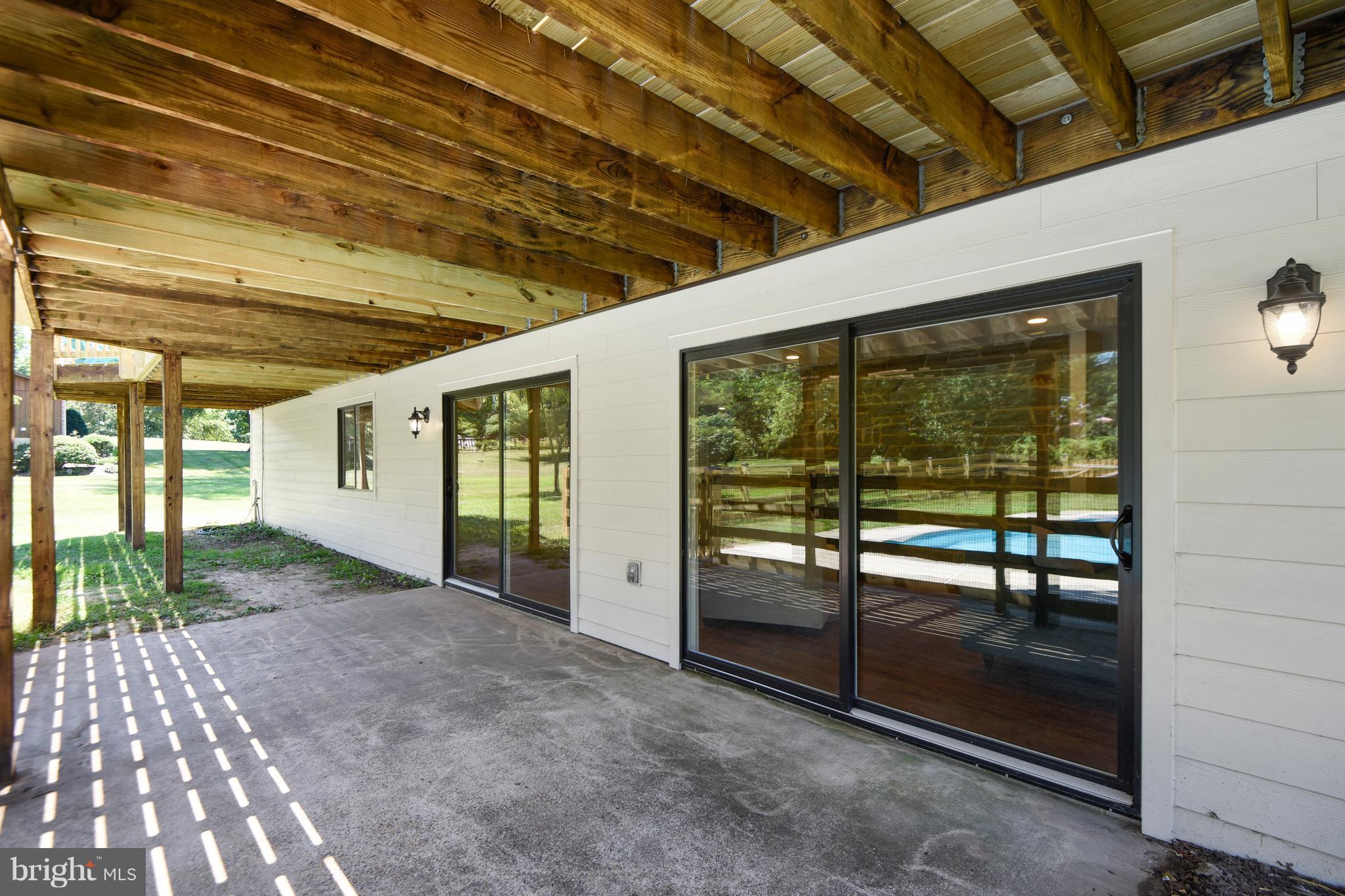 741 Appomattox Road West Davidsonville, MD 21035 - Photo 21 of 24 Shaded patio for cooling off, watching swimmers