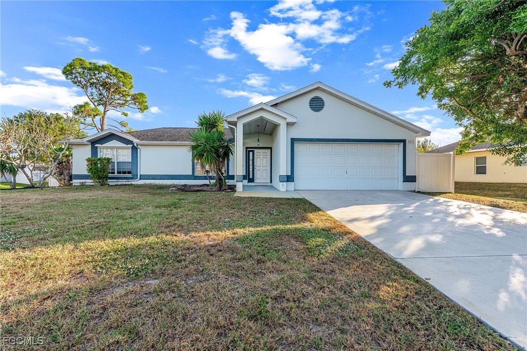 8468 Grove Road Fort Myers, FL 33967 - Photo 1 of 24 a front view of house with yard and green space
