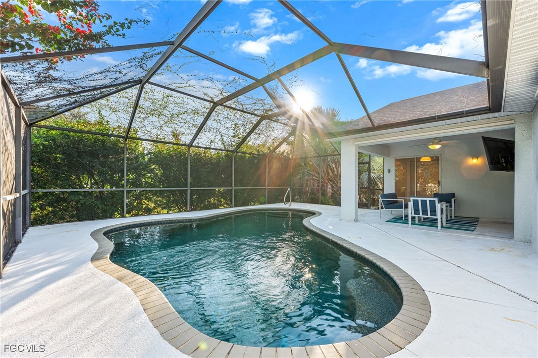 8468 Grove Road Fort Myers, FL 33967 - Photo 21 of 24 a view of a swimming pool with a patio