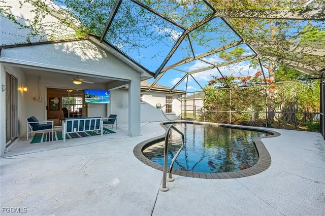 a view of a swimming pool with a patio