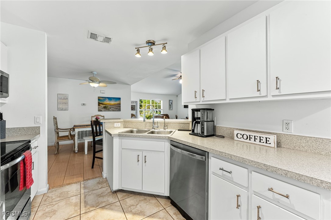 8468 Grove Road Fort Myers, FL 33967 - Photo 10 of 24 a kitchen with a sink and cabinets