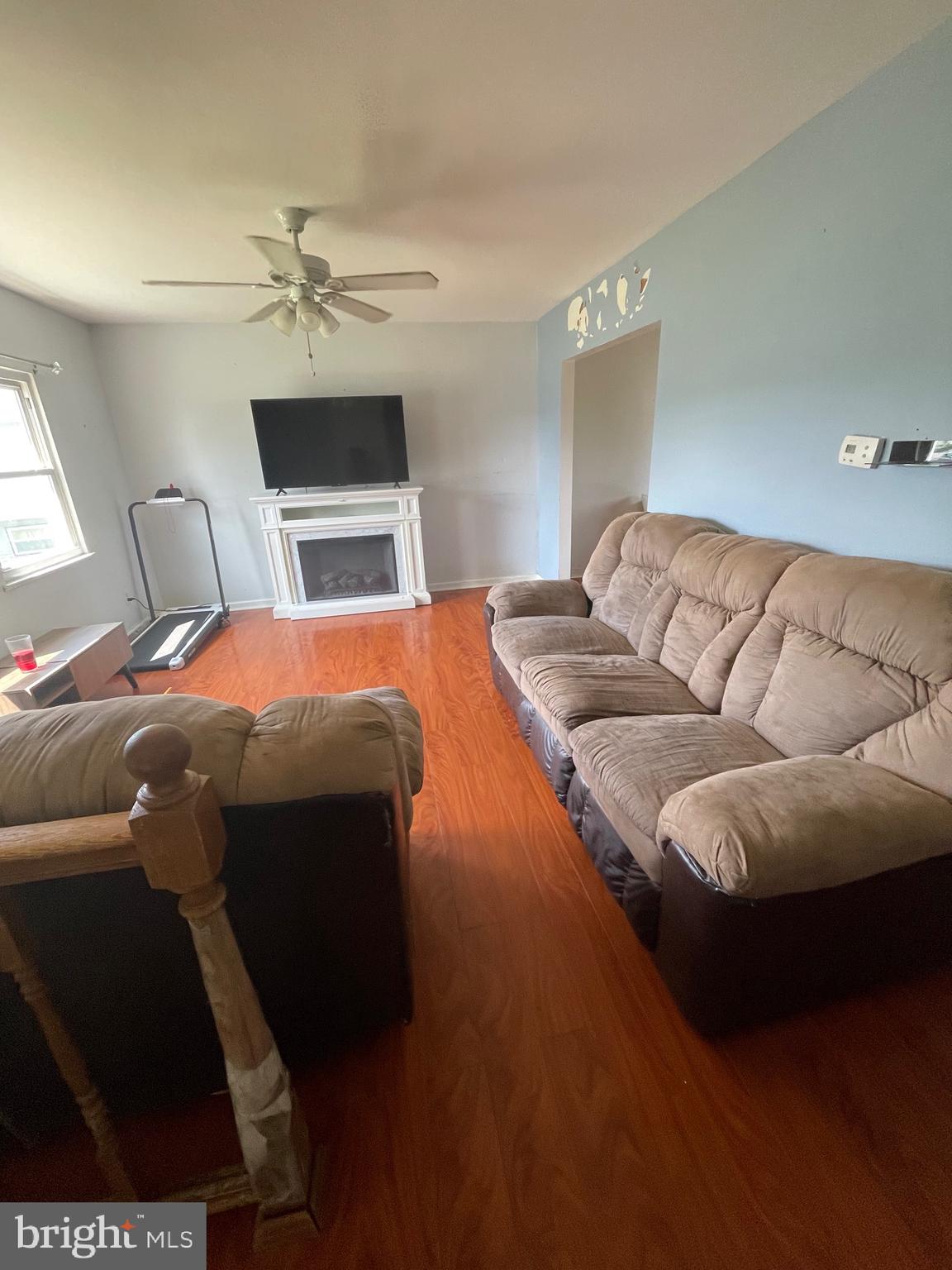 233 Rutgers Avenue Pemberton, NJ 08068 - Photo 5 of 8 a bedroom with a bed and a chandelier
