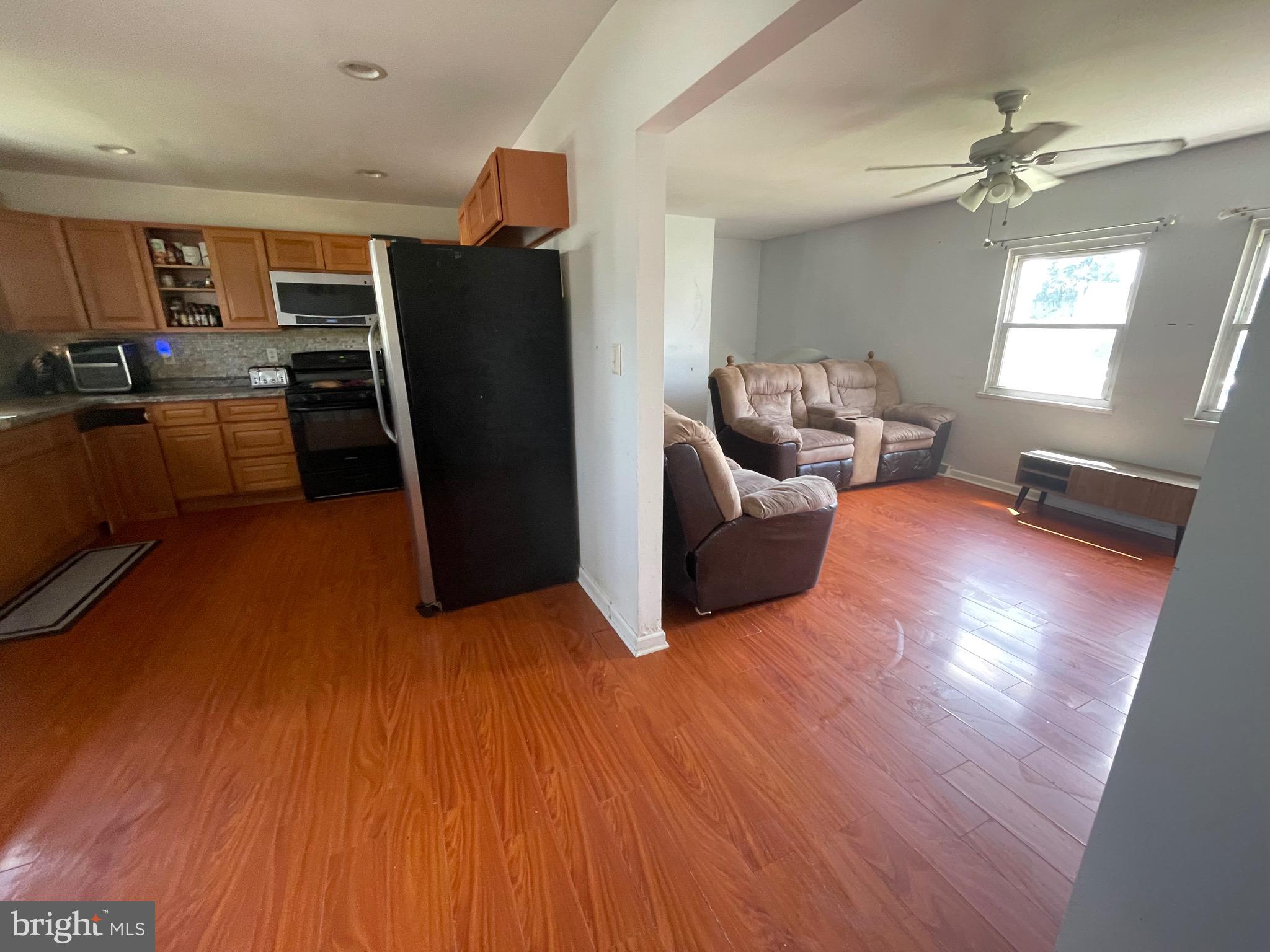 233 Rutgers Avenue Pemberton, NJ 08068 - Photo 8 of 8 a living room with furniture and a kitchen