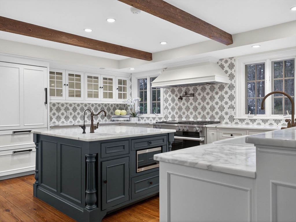 12 Winding River Circle Wellesley, MA 02482 - Photo 14 of 40 a kitchen with a sink stove and cabinets