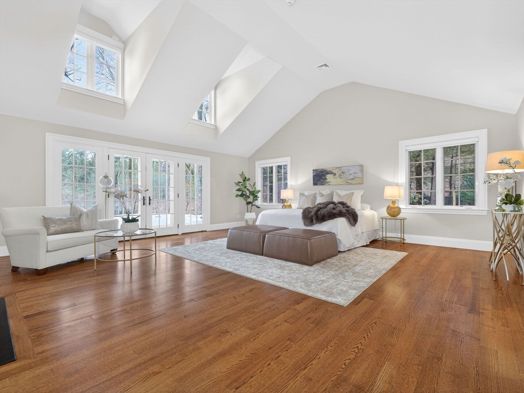 12 Winding River Circle Wellesley, MA 02482 - Photo 19 of 40 a living room with furniture a fireplace and a table