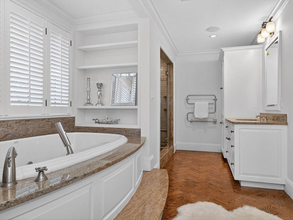 12 Winding River Circle Wellesley, MA 02482 - Photo 22 of 40 a bathroom with a tub sink and mirror