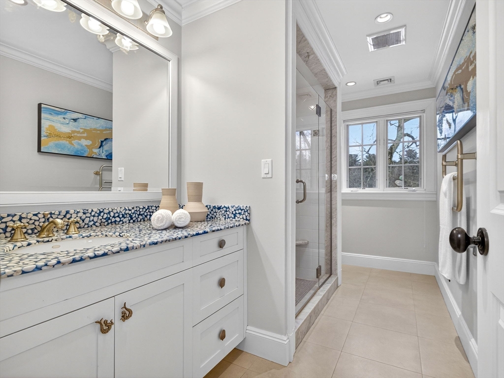 12 Winding River Circle Wellesley, MA 02482 - Photo 24 of 40 a bathroom with a sink and mirror