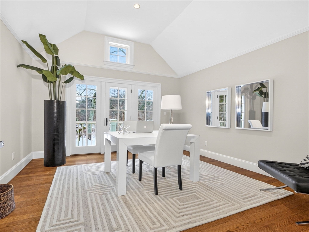 12 Winding River Circle Wellesley, MA 02482 - Photo 25 of 40 a dining room with wooden floor and large windows